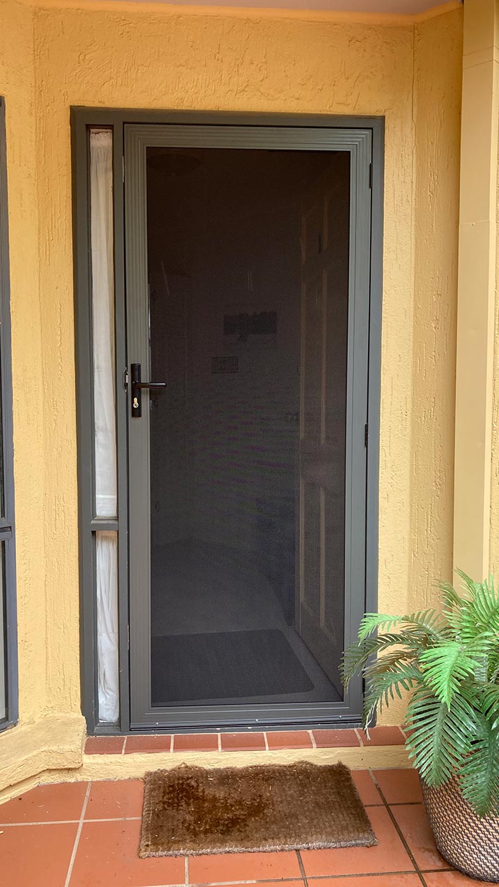 Black hinged security door with mesh panel by Thomo's Home Improvements Canberra