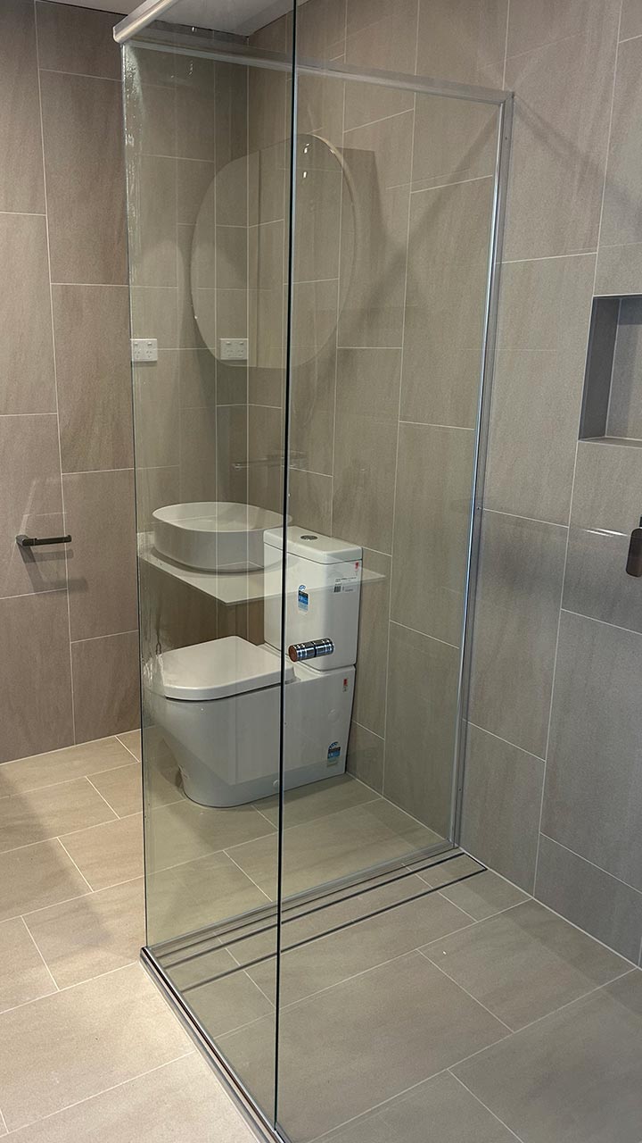 Frameless shower screen with 10mm glass panel by Thomo's Home Improvements
