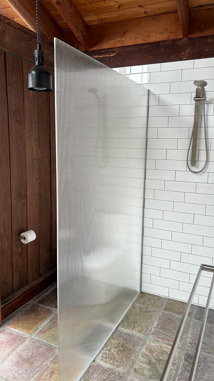 Semi-frameless shower enclosure with chrome handle by Thomo's Home Improvements