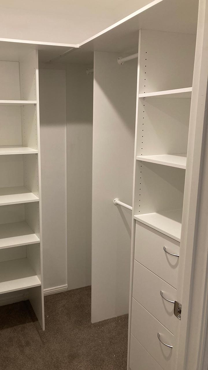 Wardrobe fit-out with shelving, drawers and double hanging rails by Thomo's Home Improvements
